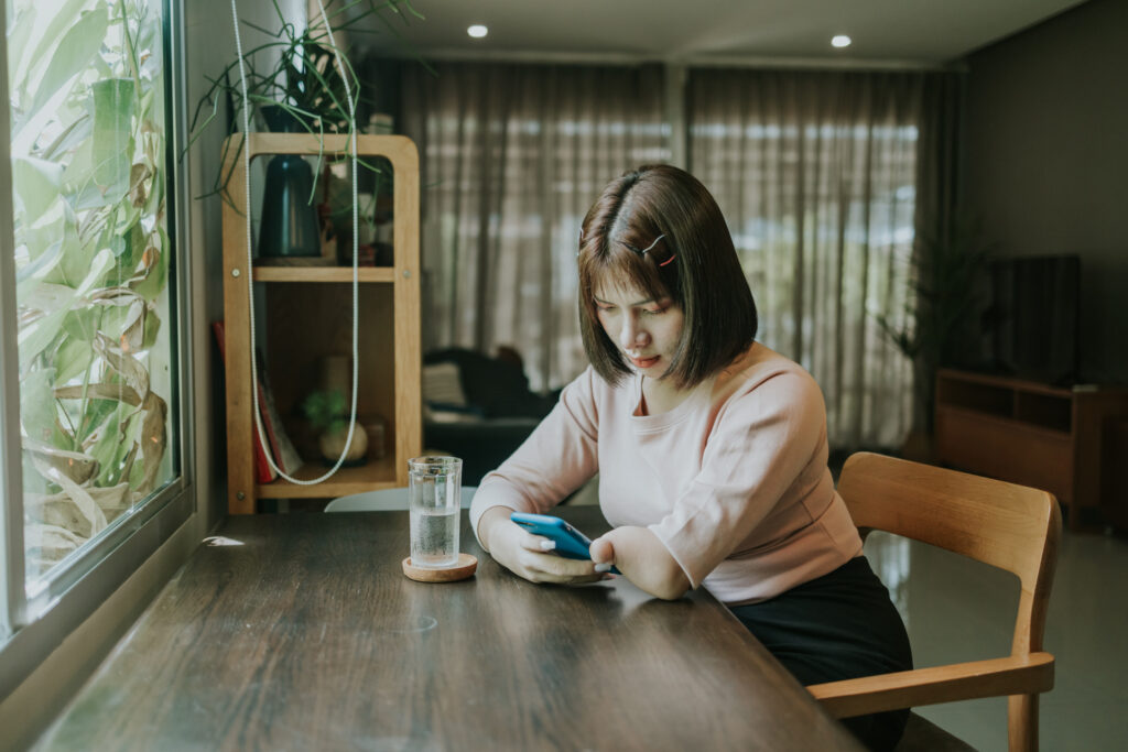 Person with disability using a mobile phone image