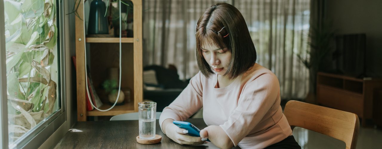 Person with disability using a mobile phone image