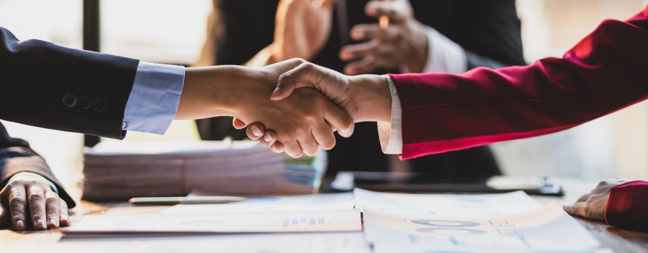 Mergers & Acquisitions hand shake at meeting